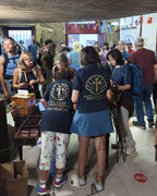 Volunteers at the Oficina do Peregrino in Porto in Camino Care polo shirts